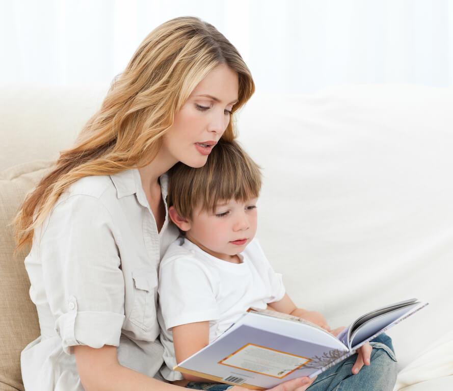 Mother sharing a captivating story with her child, fostering a lifelong love for reading and learning.